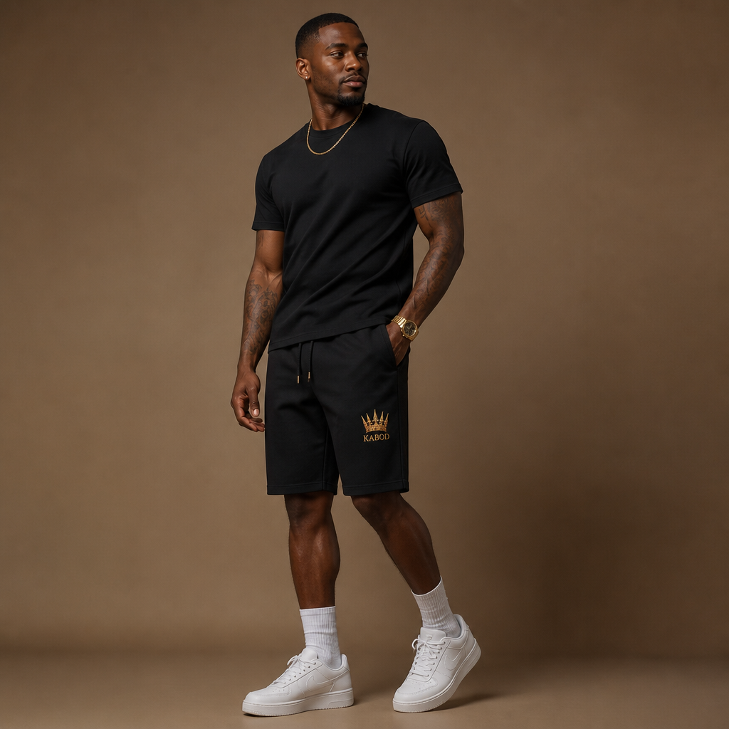 Model wearing Kabod black tee and fleece shorts